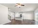 Open floor plan with a combined kitchen, living room and staircase at 420 Blue Aspen Dr, Fuquay Varina, NC 27526