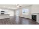 Open floor plan with a combined kitchen, living room and fireplace at 420 Blue Aspen Dr, Fuquay Varina, NC 27526