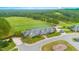 Golf clubhouse with surrounding green landscape at 45 Quail Pt, Pittsboro, NC 27312