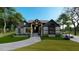 Two-story home with gray siding, a modern design, and a landscaped lawn at 45 Quail Pt, Pittsboro, NC 27312