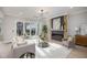 Living room with fireplace, glass doors, and modern decor at 45 Quail Pt, Pittsboro, NC 27312