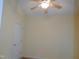 Bedroom with ceiling fan and large closet at 513 Port Dr, Henderson, NC 27537