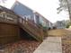 Wooden deck with stairs leading to backyard at 513 Port Dr, Henderson, NC 27537