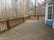 Spacious wooden deck overlooking wooded backyard at 513 Port Dr, Henderson, NC 27537