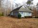 Ranch-style home with gray siding and landscaping at 513 Port Dr, Henderson, NC 27537