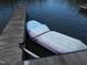 Lakefront dock with floating mat for swimming and relaxation at 513 Port Dr, Henderson, NC 27537