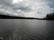 Expansive lake view under a partly cloudy sky at 513 Port Dr, Henderson, NC 27537