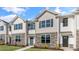 Charming two-story townhouse with stone accents, neutral siding, and symmetrical windows at 531 Old Battle Bridge Rd, Wendell, NC 27591