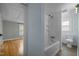 Bright bathroom featuring a shower over tub, toilet, with access to the adjacent bedroom at 826 Carter Ave, Durham, NC 27703