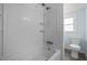 Bright bathroom featuring a shower over tub, toilet, and sleek fixtures for a modern touch at 826 Carter Ave, Durham, NC 27703