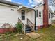 Close-up of the entrance featuring white stairs and an ADT security sign at 826 Carter Ave, Durham, NC 27703