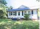 Single-story home featuring a new roof and dark shutters at 826 Carter Ave, Durham, NC 27703