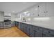 Modern kitchen featuring granite counters, white cabinets, and stainless steel appliances at 826 Carter Ave, Durham, NC 27703