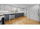 Well-lit kitchen with white subway tile backsplash, gray cabinets and stainless steel appliances at 826 Carter Ave, Durham, NC 27703