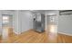 Kitchen featuring stainless steel refrigerator and wood flooring at 826 Carter Ave, Durham, NC 27703