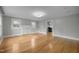 Open living room featuring neutral paint and wood floors at 826 Carter Ave, Durham, NC 27703