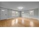 Inviting living room with wood floors, natural light, and neutral paint at 826 Carter Ave, Durham, NC 27703