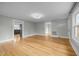 Spacious living room with wood floors and neutral walls at 826 Carter Ave, Durham, NC 27703