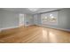 Bright living room with hard wood floors and natural light at 826 Carter Ave, Durham, NC 27703