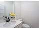 Modern half bathroom features a white vanity with quartz countertop and matte black faucet at 110-A S Hyde Park Ave, Durham, NC 27703