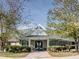 Exterior of community clubhouse featuring a modern design, green roof, and well-maintained landscaping at 12 Cabin Crk, Pittsboro, NC 27312