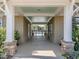 Covered walkway leads to the community pool with stone columns and painted ceiling at 12 Cabin Crk, Pittsboro, NC 27312