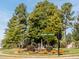 Charming community corner with a Cabin Creek and Golfers View street sign amidst lush landscaping and mature trees at 12 Cabin Crk, Pittsboro, NC 27312