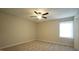 Spacious bedroom with ceiling fan and neutral carpeting at 141 Jones Franklin Rd # G, Raleigh, NC 27606