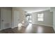 Spacious living room with hardwood floors and natural light at 141 Jones Franklin Rd # G, Raleigh, NC 27606