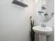 Contemporary powder room with a pedestal sink, modern fixtures, and stylish decor at 236 George Pine Way, Knightdale, NC 27545