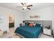 Comfortable bedroom with a bed, ceiling fan, and an ensuite bathroom at 236 George Pine Way, Knightdale, NC 27545