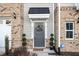 Charming front door with wreath and stylish landscaping at 236 George Pine Way, Knightdale, NC 27545
