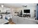 Spacious living room with a modern kitchen, comfortable sofa and Christmas decorations at 236 George Pine Way, Knightdale, NC 27545