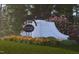 Renaissance at White Oak community sign amid lush landscaping and seasonal flowers, marking an upscale neighborhood at 308 Chesapeak Commons St # 145, Garner, NC 27529