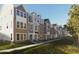 Charming townhome row featuring brick facades, multi-pane windows, and well-manicured lawns, creating an inviting curb appeal at 308 Chesapeak Commons St # 145, Garner, NC 27529
