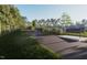 Scenic community walking path with lush greenery and benches offers a serene outdoor experience at 308 Chesapeak Commons St # 145, Garner, NC 27529