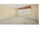 Well-lit bedroom with plush carpeting and a ceiling fan at 373 Fred Stone Rd, Sanford, NC 27332