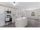 Bright kitchen with stainless steel oven, island, and white cabinetry at 409 Avery Street St, Garner, NC 27529