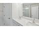 Modern bathroom featuring double sinks, a large mirror, and a walk-in shower at 43 Honeydew Way, Clayton, NC 27520