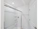 Bathroom featuring a modern glass shower, towel rack and a white door at 43 Honeydew Way, Clayton, NC 27520