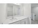 Bathroom showcasing a large mirror above the white quartz countertop and sink at 43 Honeydew Way, Clayton, NC 27520