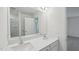 Bright bathroom with double sinks, quartz countertop and a large mirror at 43 Honeydew Way, Clayton, NC 27520
