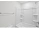A full, white bathtub shower combination featuring chrome fixtures at 43 Honeydew Way, Clayton, NC 27520