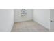 A bedroom featuring neutral carpet, base molding and a double window at 43 Honeydew Way, Clayton, NC 27520