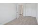 A neutral bedroom featuring an open door to a bathroom at 43 Honeydew Way, Clayton, NC 27520