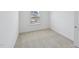 Bedroom featuring neutral carpet, white walls and a double window at 43 Honeydew Way, Clayton, NC 27520