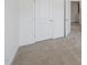 A bright bedroom featuring neutral carpet and a white door to the side at 43 Honeydew Way, Clayton, NC 27520