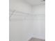 Walk-in closet with wire shelving for organized storage and neutral carpet at 43 Honeydew Way, Clayton, NC 27520