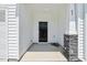 Inviting entryway showcasing a stylish black door and stone-accented pillars at 43 Honeydew Way, Clayton, NC 27520