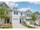 Attractive townhouse exteriors with diverse siding, lawns, and blue sky background at 43 Honeydew Way, Clayton, NC 27520